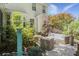 Charming patio with wicker furniture, lush plants, and an outdoor shower, creating a serene retreat at 1087 Clearspring Dr, Charleston, SC 29412