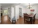 Bright dining room with hardwood floors, white trim, and a view into the kitchen at 1087 Clearspring Dr, Charleston, SC 29412