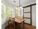 Charming dining area featuring natural light, wooden table, and sliding door at 1087 Clearspring Dr, Charleston, SC 29412