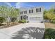 Charming two-story home with white trim, a covered porch, and a two-car garage at 1087 Clearspring Dr, Charleston, SC 29412