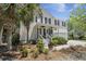 Charming two-story home with a welcoming front porch, manicured landscaping, and an attached garage at 1087 Clearspring Dr, Charleston, SC 29412