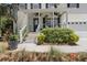 Inviting front porch with hanging plants, rocking chairs, and well-manicured landscaping, offering curb appeal at 1087 Clearspring Dr, Charleston, SC 29412