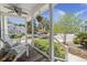 Inviting front porch with ceiling fan, white rocking chairs, and well-maintained landscaping at 1087 Clearspring Dr, Charleston, SC 29412
