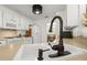 Bright kitchen features white cabinets, countertop, sink, faucet, and appliances at 1087 Clearspring Dr, Charleston, SC 29412