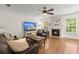 Bright living room with hardwood floors, fan, fireplace, and comfortable furniture at 1087 Clearspring Dr, Charleston, SC 29412