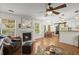 Cozy living room with hardwood floors, a fireplace, and large windows at 1087 Clearspring Dr, Charleston, SC 29412