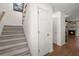 Bright staircase with carpeted steps and white walls, leading to the upper level of the home at 1087 Clearspring Dr, Charleston, SC 29412