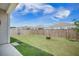 Fenced backyard with a well-maintained lawn, offering privacy and space for outdoor activities at 110 Green Passage Ln, Summerville, SC 29486