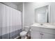 Bathroom featuring a shower-tub combo with shower curtain and a white single sink vanity at 110 Green Passage Ln, Summerville, SC 29486