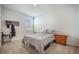 Cozy bedroom with a warm carpet, queen bed with side tables, and a wooden flag wall decoration at 110 Green Passage Ln, Summerville, SC 29486