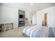Comfortable bedroom features built-in fireplace, TV, and stylish decor with ensuite bathroom at 110 Green Passage Ln, Summerville, SC 29486