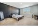 This bedroom showcases a dark accent wall with custom woodwork, and lots of natural light at 110 Green Passage Ln, Summerville, SC 29486