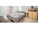 Modest bedroom with neutral tones, a comfortable bed, and a decorative shelf at 110 Green Passage Ln, Summerville, SC 29486