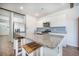 Bright kitchen featuring granite island with seating, stainless steel appliances, and ample cabinet space at 110 Green Passage Ln, Summerville, SC 29486