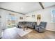 Comfortable living room with wood floors, stylish decor, and access to the backyard at 110 Green Passage Ln, Summerville, SC 29486
