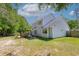 The backyard features a wooden pergola and a spacious lawn at 110 Mapperton Ct, Summerville, SC 29485