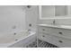 Updated bathroom featuring a soaking tub, patterned floors, and an updated vanity at 110 Mapperton Ct, Summerville, SC 29485