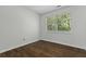 Bright bedroom features a large window and beautiful laminate wood flooring at 110 Mapperton Ct, Summerville, SC 29485
