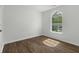Bright bedroom features a large window and beautiful laminate wood flooring at 110 Mapperton Ct, Summerville, SC 29485