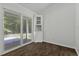 Bright dining area featuring wood flooring and sliding glass doors leading to an outdoor patio at 110 Mapperton Ct, Summerville, SC 29485