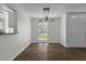 Dining area features modern lighting, window views, and seamless access to kitchen at 110 Mapperton Ct, Summerville, SC 29485