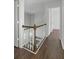 Hallway showcasing wood flooring and a view of the living area below at 110 Mapperton Ct, Summerville, SC 29485