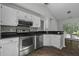 Well-equipped kitchen with stainless steel appliances, white cabinetry, and stylish backsplash at 110 Mapperton Ct, Summerville, SC 29485