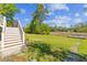 Expansive backyard with direct waterfront access and a wooden dock at 112 Berkshire Dr, Wando, SC 29492