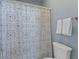 Bathroom featuring a shower with a patterned shower curtain and white towels at 112 Berkshire Dr, Wando, SC 29492