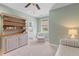 Inviting bedroom featuring a cozy armchair and an antique cabinet at 112 Berkshire Dr, Wando, SC 29492