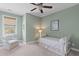 Bright bedroom with a comfortable chair and a twin-sized bed, creating a relaxing space at 112 Berkshire Dr, Wando, SC 29492