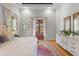 Cozy bedroom with hardwood floors, French doors, and a decorative rug at 112 Berkshire Dr, Wando, SC 29492