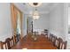 Elegant dining room features rich wood table and bright natural light at 112 Berkshire Dr, Wando, SC 29492