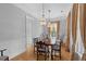 Formal dining room features hardwood floors and classic crystal chandeliers at 112 Berkshire Dr, Wando, SC 29492