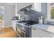 Gourmet kitchen with a professional-grade range, marble countertops, and custom cabinetry at 112 Berkshire Dr, Wando, SC 29492