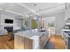 Modern kitchen with an island, stainless steel appliances, and an open design leading to living spaces at 112 Berkshire Dr, Wando, SC 29492