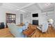 Inviting living room with a cozy fireplace, built-in shelves, and comfortable seating arrangement at 112 Berkshire Dr, Wando, SC 29492