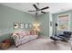 Comfortable sitting area with couch, chair, natural light, and ceiling fan at 112 Berkshire Dr, Wando, SC 29492