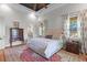 The main bedroom includes a dark wood ceiling fan and furniture and natural light from two windows at 112 Berkshire Dr, Wando, SC 29492