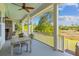 Spacious porch with seating area overlooking water views at 112 Berkshire Dr, Wando, SC 29492