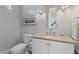 Elegant powder room features marble countertops, classic fixtures, and a framed mirror at 112 Berkshire Dr, Wando, SC 29492