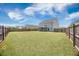 Large, level backyard is completely fenced, and offers great views of the home's rear elevation at 1130 Moss Grove Dr, Moncks Corner, SC 29461