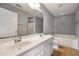 Bathroom featuring a double sink vanity, large mirror, and a separate tub and shower at 1130 Moss Grove Dr, Moncks Corner, SC 29461