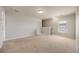Neutral bedroom featuring carpet floors, gray walls, window, and staircase access at 1130 Moss Grove Dr, Moncks Corner, SC 29461