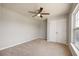 Neutral bedroom with plush carpeting, ceiling fan, closet and natural light at 1130 Moss Grove Dr, Moncks Corner, SC 29461