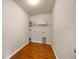 Functional laundry room with laminate floors, shelving and washer/dryer hookups at 1130 Moss Grove Dr, Moncks Corner, SC 29461