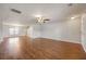 Bright living room featuring beautiful hardwood floors, a ceiling fan, large windows and freshly painted walls, perfect for relaxation at 1130 Moss Grove Dr, Moncks Corner, SC 29461