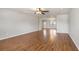 Spacious living room with hardwood floors, neutral paint, ceiling fan, and ample natural light creating a warm and inviting atmosphere at 1130 Moss Grove Dr, Moncks Corner, SC 29461