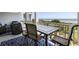 Overlooking the shoreline and ocean views, the balcony provides seating and an outdoor dining space at 1140 Ocean Blvd # 201, Isle of Palms, SC 29451