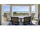 Enjoy the view of the ocean from the balcony with seating for four and a relaxing place to dine at 1140 Ocean Blvd # 201, Isle of Palms, SC 29451
